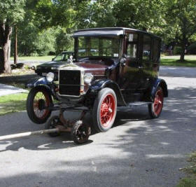 Weaver Auto Ambulance Shown with Car being towed